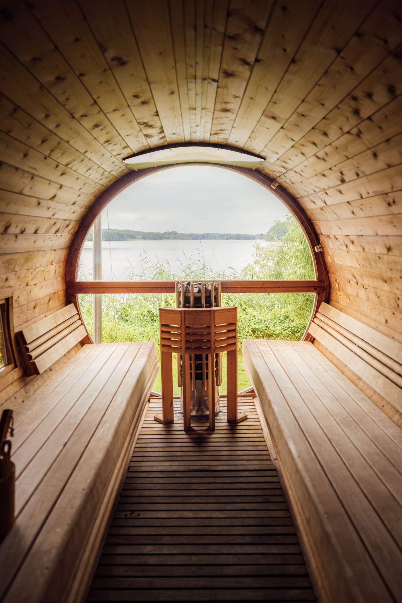 Barrel sauna framing a lake view